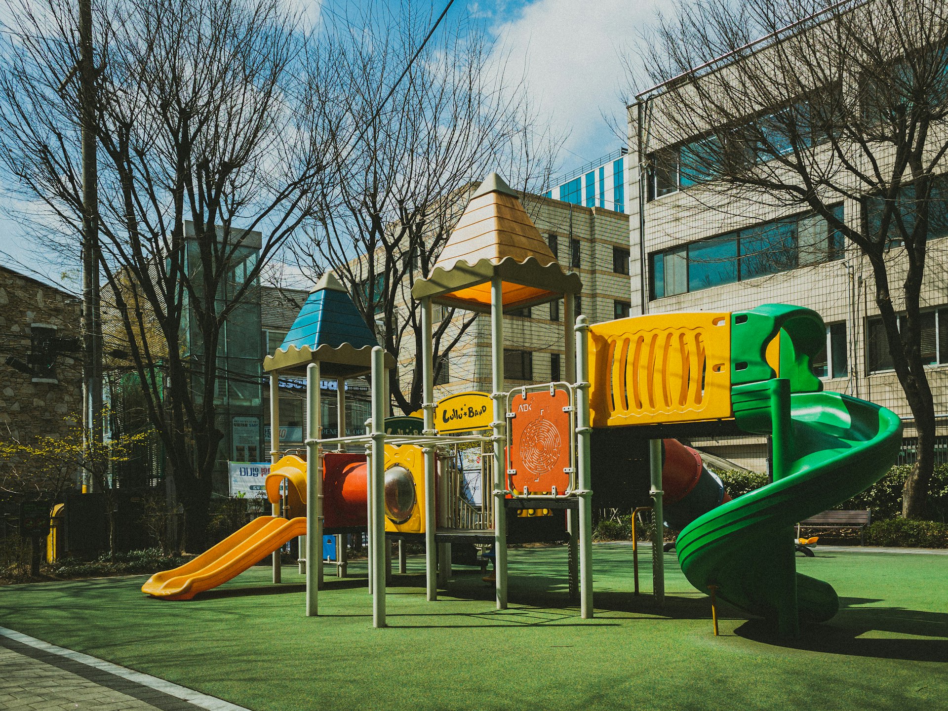 a children's play area in front of a building